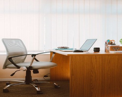 A modern bright office space with an ergonomic chair emphasizing healthy posture and breaks